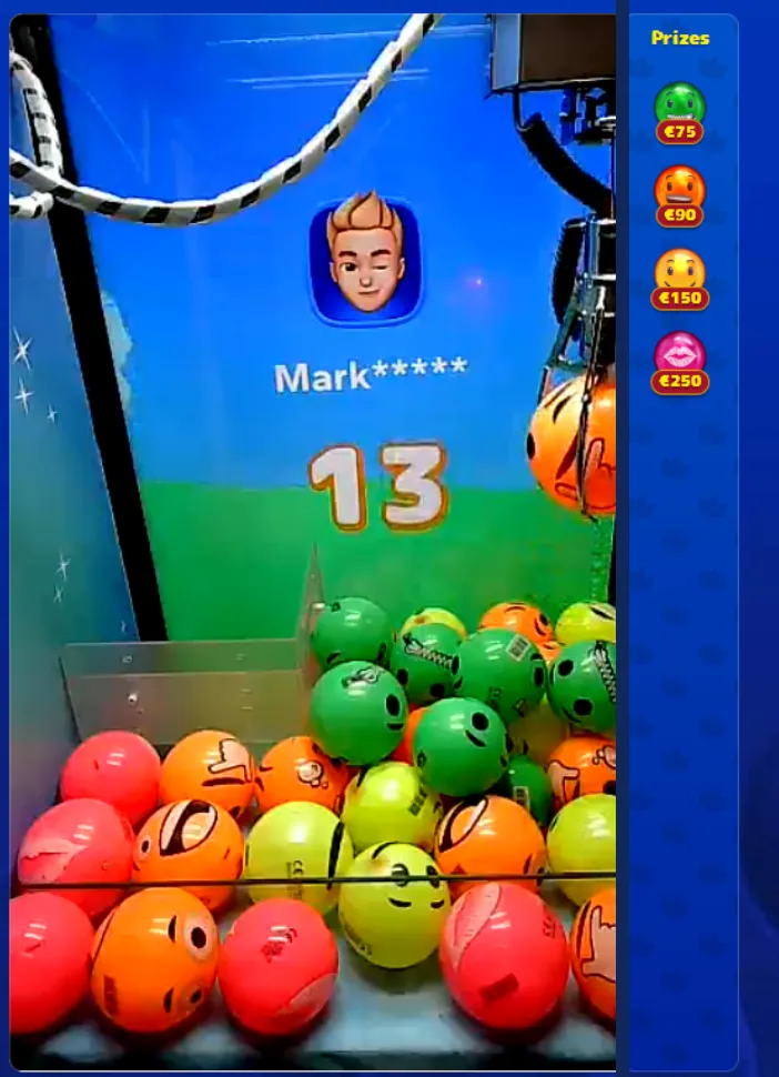 Cash Crab Fancy Faces emoji claw machine with green, orange, yellow and pink face balls up to a x5 jackpot